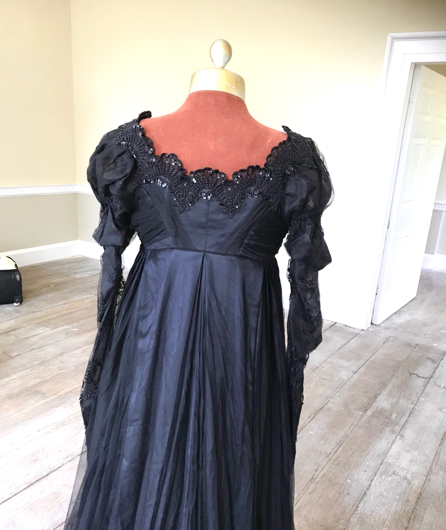 A fine quality lady's black satin, chiffon and jet trimmed Regency style evening dress with long train, lacing on jet stomacher. Ex English National Opera (unlabelled) 'Don Giovanni'